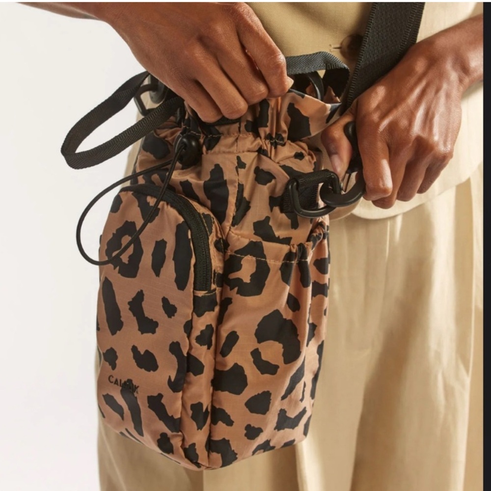 Calpak Water Bottle Holder leopard print insulated pocket.